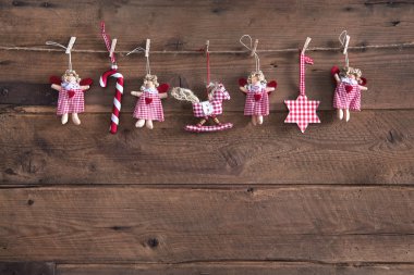 Country style christmas handmade decoration hanging on an old ru