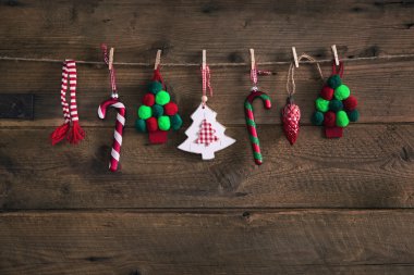 Country style christmas handmade decoration hanging on an old ru