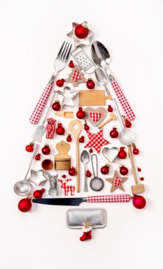 Christmas tree of old and antique miniatures in red, silver and 