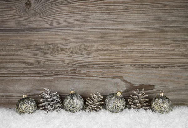 Old antique wooden christmas background with balls and pin corns — Stok fotoğraf