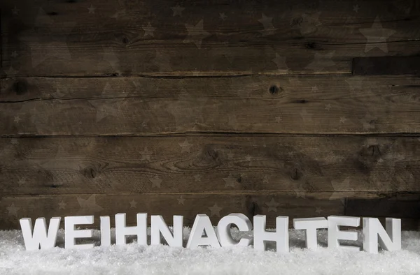 Fundo de madeira velha com letras alemãs brancas para o Natal . Imagem De Stock