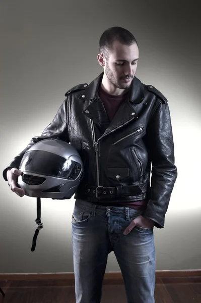 Biker in leather jacket and helmet — Stock Photo, Image