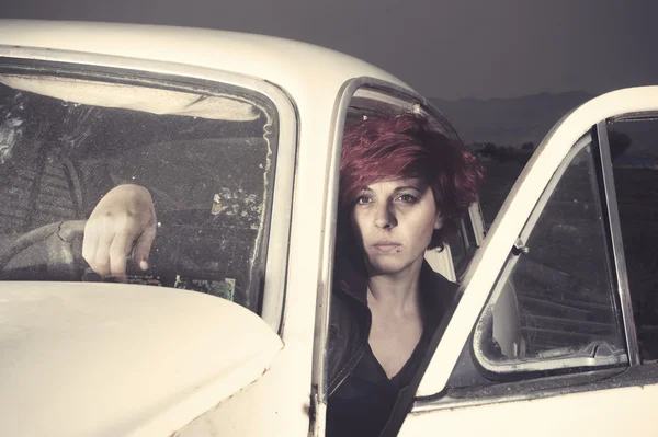 Woman inside an old car — Stock Fotó