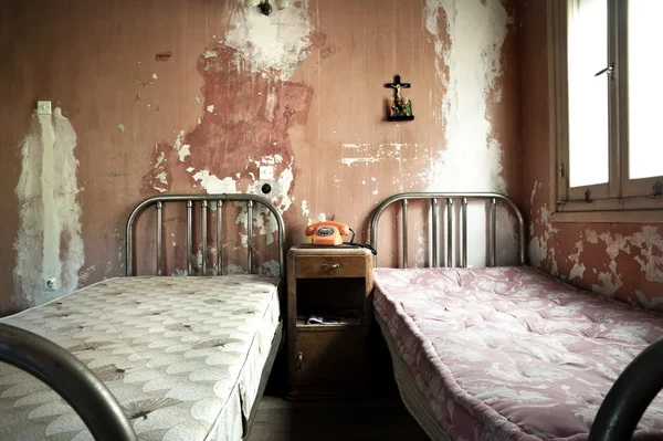 Creepy dirty and abandoned bedroom Stock Image