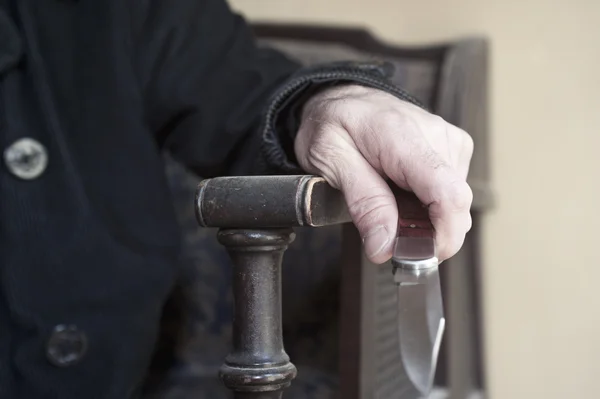 Hand holding knife close up — Stock Photo, Image