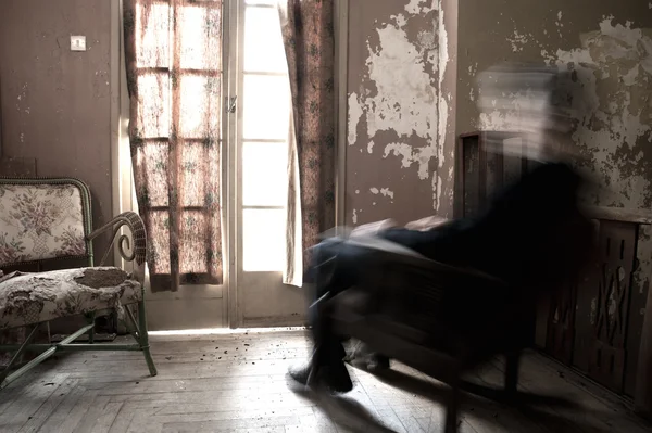 Man sitting on rocking chair — Stock Photo, Image