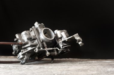Carburetor on wooden surface