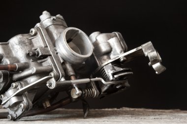 Carburetor on wooden surface