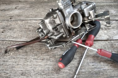 Carburetor and screwdrivers