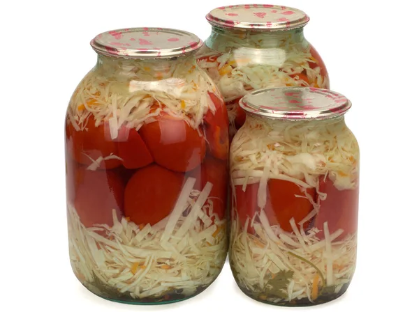 Консервовані та мариновані помідори та капуста у скляній банці. Домашні мариновані овочі . Стокова Картинка