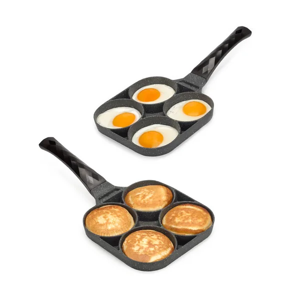 Two frying pans with scrambled eggs and pancakes top view. Isolated on white — Stock Photo, Image