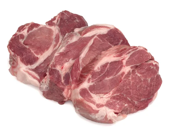 Three raw pork neck meat cuts on a white — Stock Photo, Image