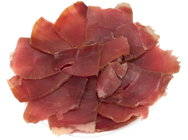 Marmellata di prosciutto spagnolo, tagliata a mano, affettata su un bianco — Foto Stock