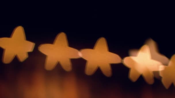 Размытые звезды Боке на чёрном фоне — стоковое видео