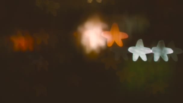 Размытые звезды Боке на чёрном фоне — стоковое видео