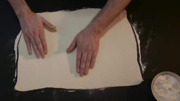 Cuts a Piece of Raw Dough into Two Parts — стоковое видео