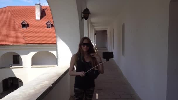 Modern Girl is Posing Against the Courtyard — Stock Video