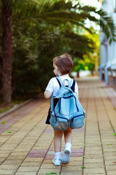 Little Girl Schoolgirl Goes School Denim Backpack Rear View — Stockfoto