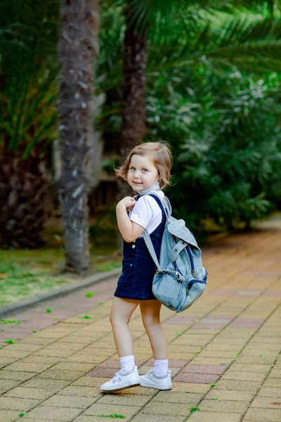 Little Girl Schoolgirl Goes School Park Denim Backpack Medical Mask — Stok fotoğraf