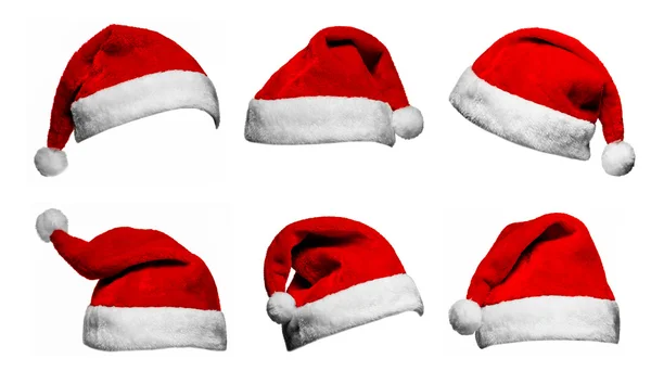 Set di cappelli Babbo Natale rossi isolati su sfondo bianco Immagine Stock