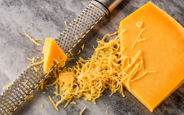 Grated Gouda Cheese Grater Stone Table Top View — Stock Photo, Image