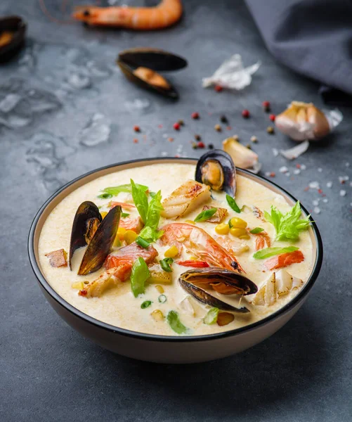 New England clam chowder, occasionally referred to as Boston or Boston-style Clam Chowder. Creamy soup with shrimp, corn, bacon and mussels.