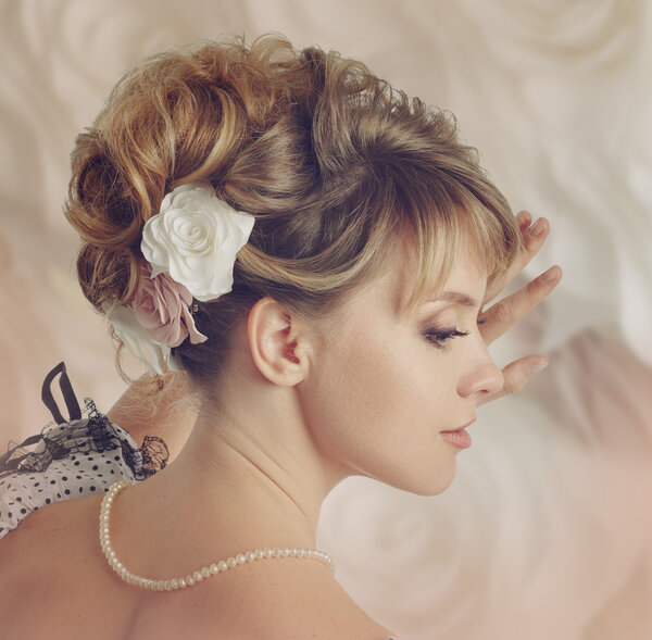 Beautiful bride with a wreath of roses.