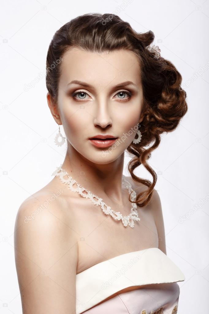 Bride. Portrait of a beautiful woman in a pink wedding dress.