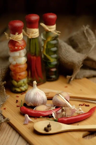 Onions, garlic and chili on a wooden table. — Stock Photo, Image