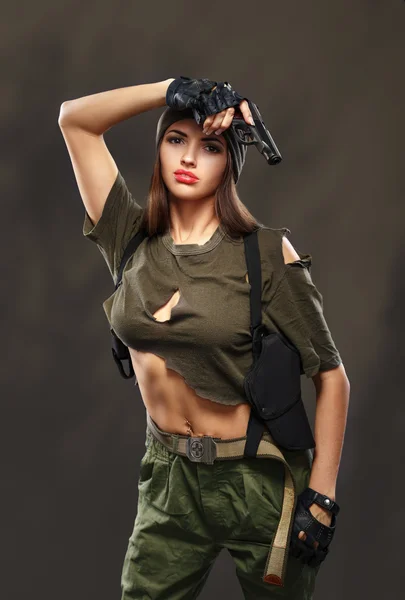 Sexy girl with gun. — Stock Photo, Image