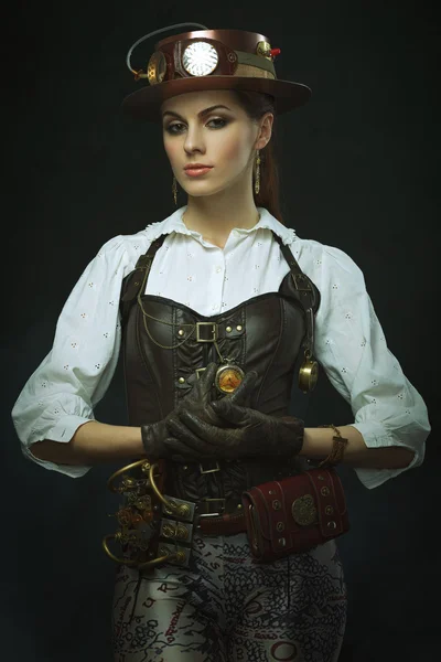 Beautiful girl steampunk. Posing with the clock — Stock Photo, Image