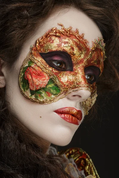 Close-up portrait of Beautiful woman in vintage dress and a mask — Stock Photo, Image