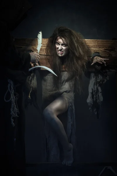 Halloween. The Middle Ages. Witch sign a verdict of the Inquisit — Stock Photo, Image