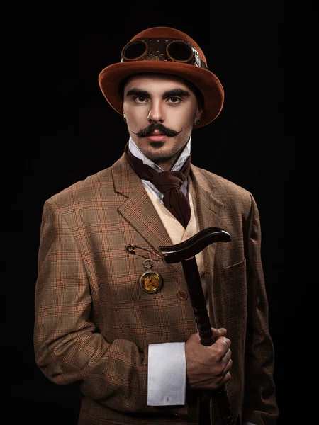 Steampunk man in a hat and with a cane. — Stock Photo, Image