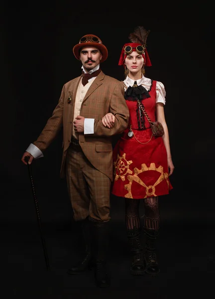 Pár steampunk. Muž s holí a dívka s brýlemi — Stock fotografie