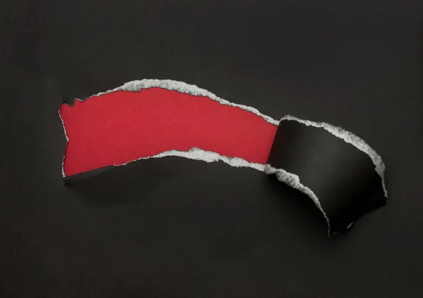 Black torn paper on red background. Black Friday campaign.