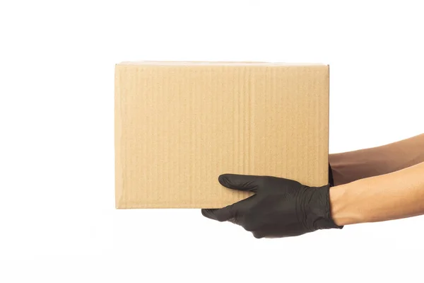 Closeup Delivery Man Hand Medical Gloves Holding Cardboard Box Isolated — Stock Photo, Image