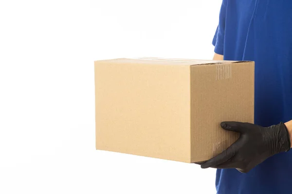 Closeup Delivery Man Hand Medical Gloves Holding Cardboard Box Isolated — Stock Photo, Image