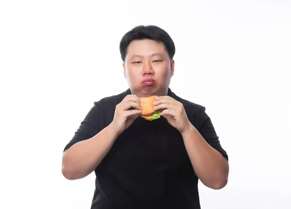 Jovem Engraçado Gordura Asiático Homem Comer Hambúrguer Isolado Fundo Branco — Fotografia de Stock