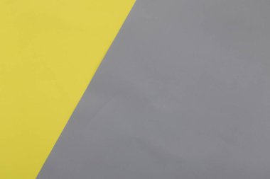 Aydınlatıcı sarı ve Ultimate Gray pastel kağıt dokusu arka plan, Geometrik düz zemin.