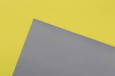 Aydınlatıcı sarı ve Ultimate Gray pastel kağıt dokusu arka plan, Geometrik düz zemin.