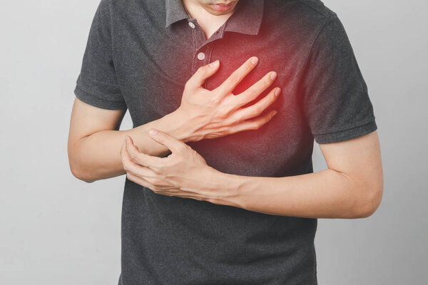 Man has chest pain suffering by heart disease, Cardiovascular disease, heart attack. Health care concept.