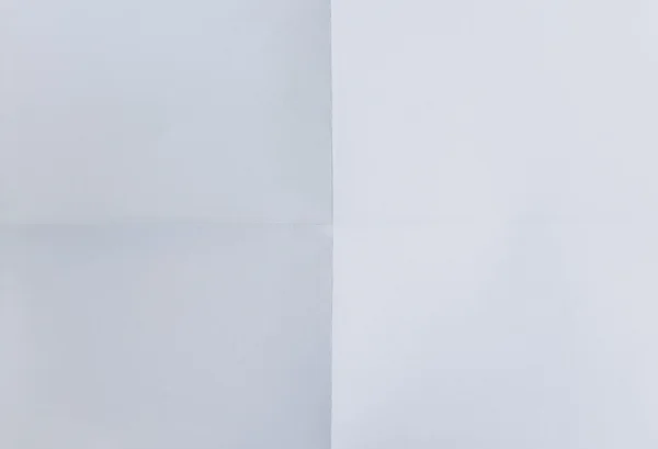Hoja blanca de papel doblada en cuatro, fondo —  Fotos de Stock