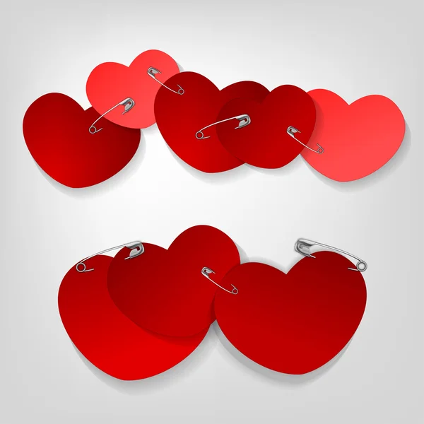 Pinned hearts — Stock Vector