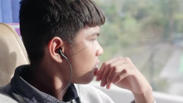 Young Asian Man Bangs Hair His Earphones Seat Bus Enjoying — Stock Video