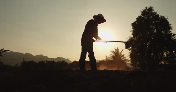 Slow Motion Silhouette Scene Rural Male Asian Farmer Digging Soil — Stock Video