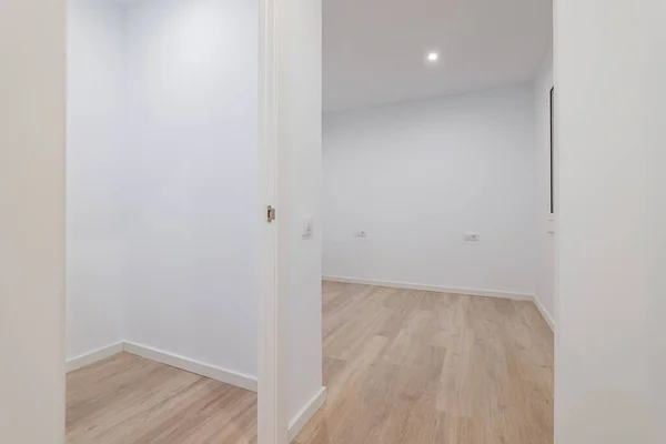 Empty small rooms with white walls. Interior of the freshly renovated room.