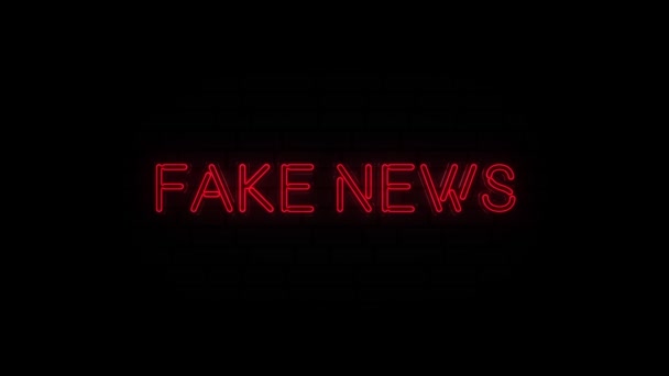 Fake news text on neon sign. Night bright advertisement. — Stockvideo