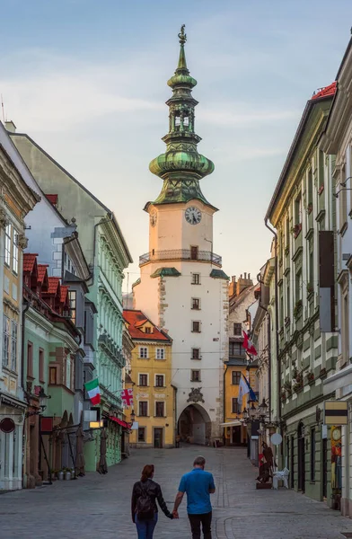 Two People Holding Hands Empty Michalska Street Bratislava Old Town 로열티 프리 스톡 사진