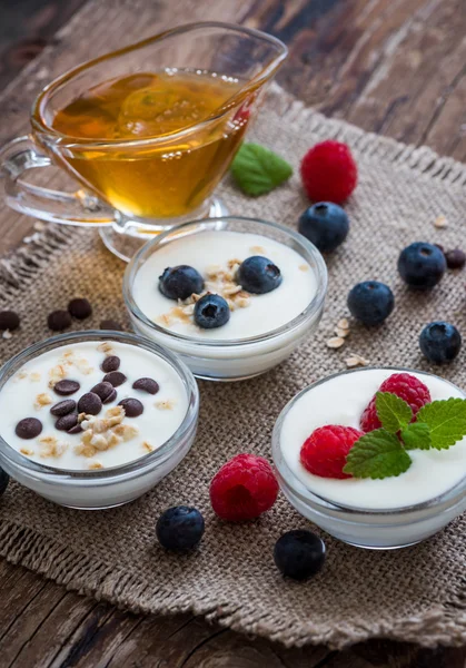 Yogurt with Fruits or Chocolate in Little Bowls — Stock Photo, Image